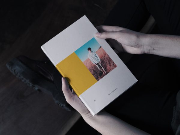 Book in Hand Mockup Free
