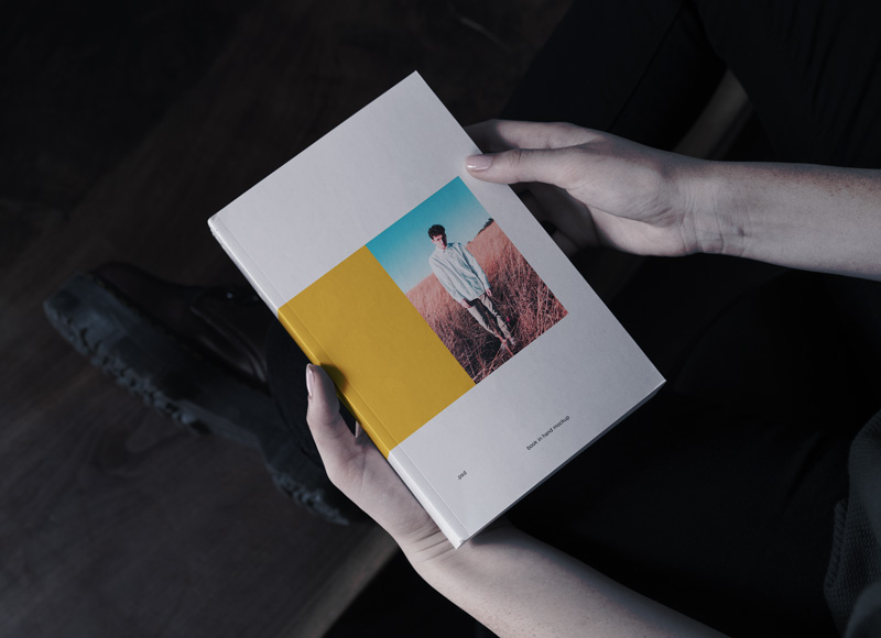 Book in Hand Mockup Free