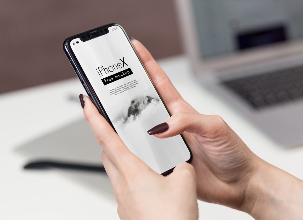 Holding iPhone X Mockup